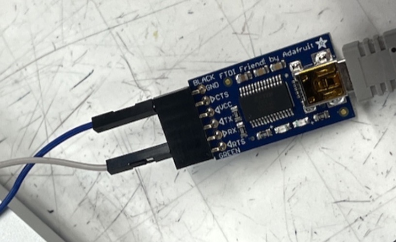 FTDI Friend plugged into USB with jumper wires connected to its RX and GND pins