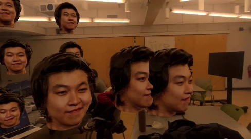 Vision Pro demo view of a classroom filled with floating copies of Andy's disembodied head