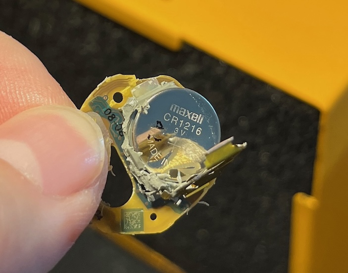 Maxell CR1216 3V coin cell battery mounted on the opened Stelo sensor board