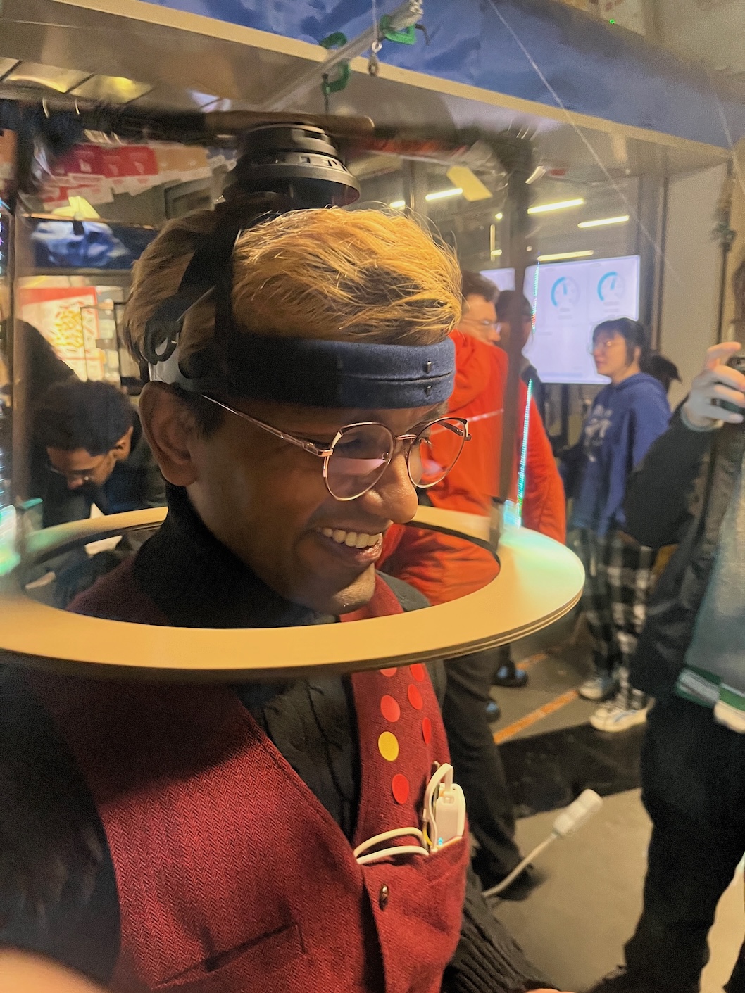 Amit and his spinning LED display hat that he built at the Seeed hackathon