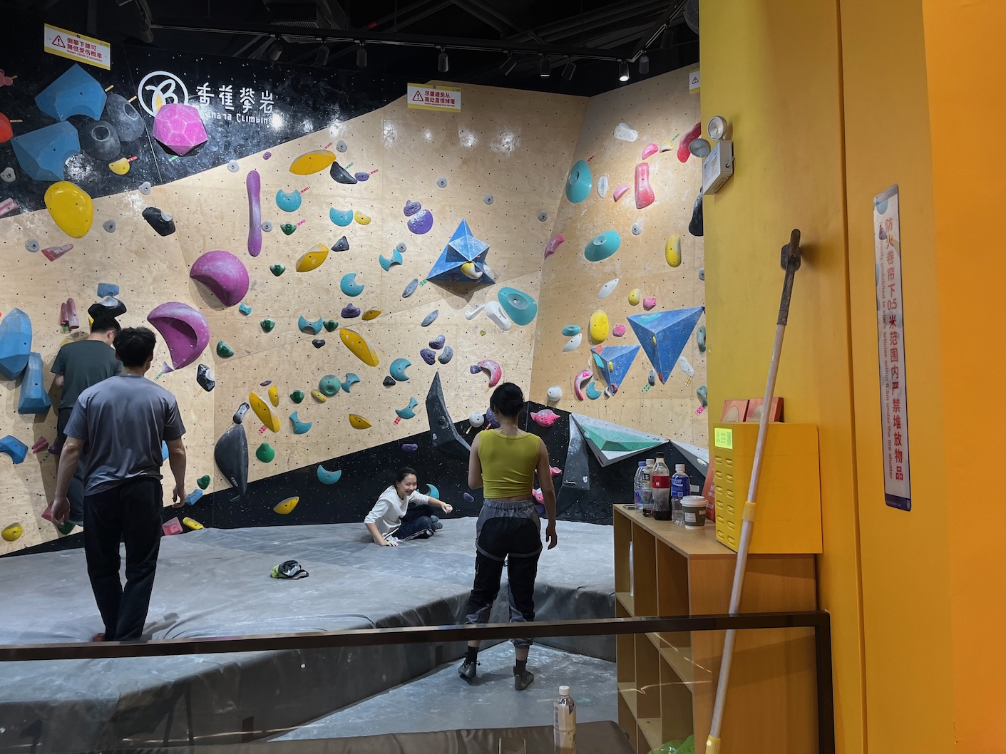 Climbing gyms in China have totally different holds and rules. One rule is you can't use a volume unless it has a hold of your route's color. Another is that any two holds that touch can be used by either route