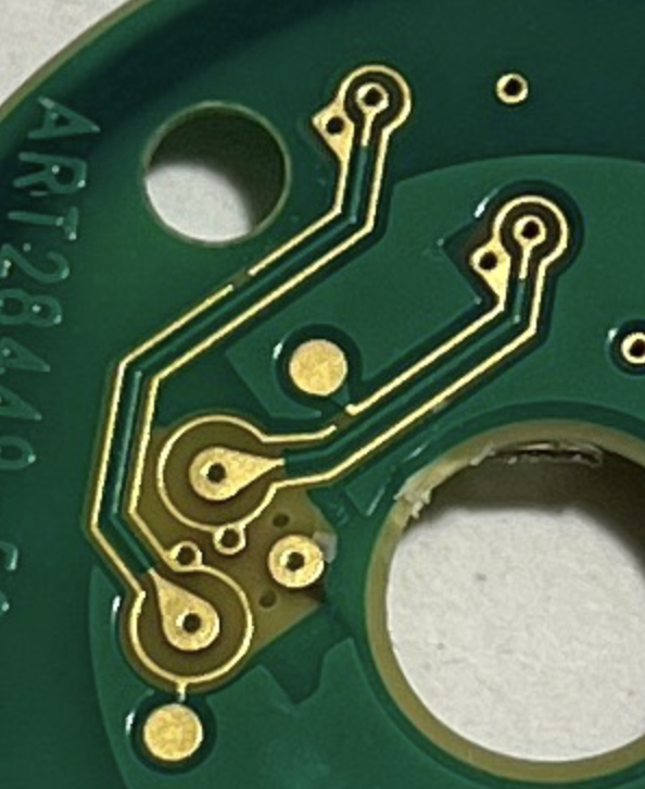 Back of the PCB where the guard ring traces continue around teardrop-shaped gold pads